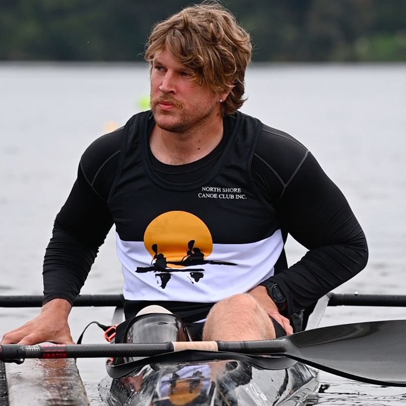 Finn sits in boat at dock preparing for race at National Champs